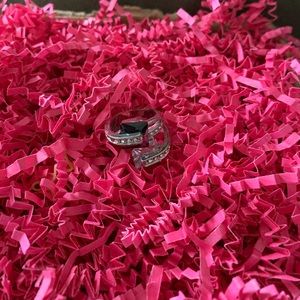 Black and white ring with diamond on it